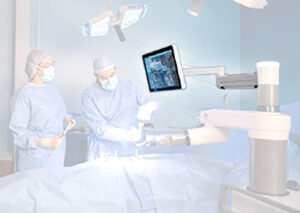Monitor arm mounted to surgical system