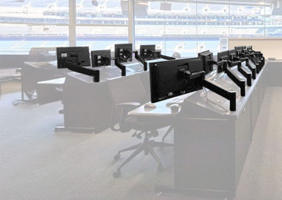 Monitor arms mounted to media & broadcast consoles
