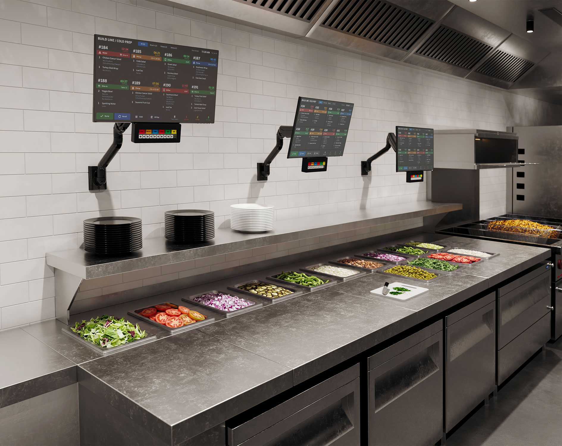 E5 wall-mounted monitor arms supporting KDS displays in a commercial kitchen food prep area