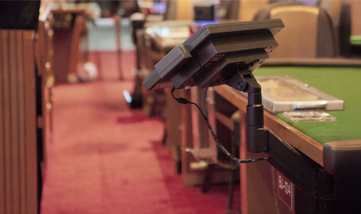 Casino Gaming Display Mount Solutions | HAT Design Works Casino gaming table with mounted display screen for dealer information and player interaction